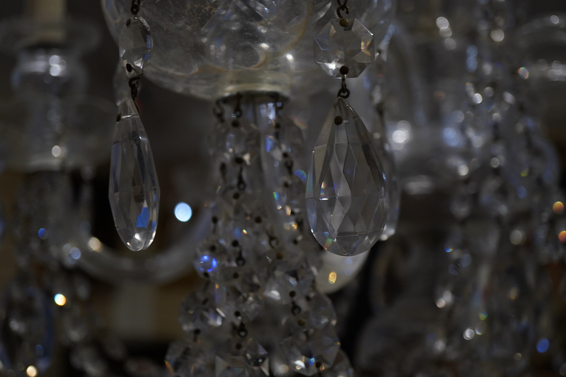 A cut glass five branch chandelier with drops